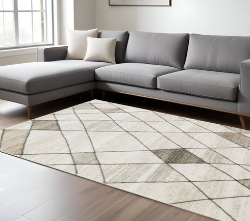 3' X 5' Beige Grey Tan And Brown Geometric Power Loom Stain Resistant Area Rug